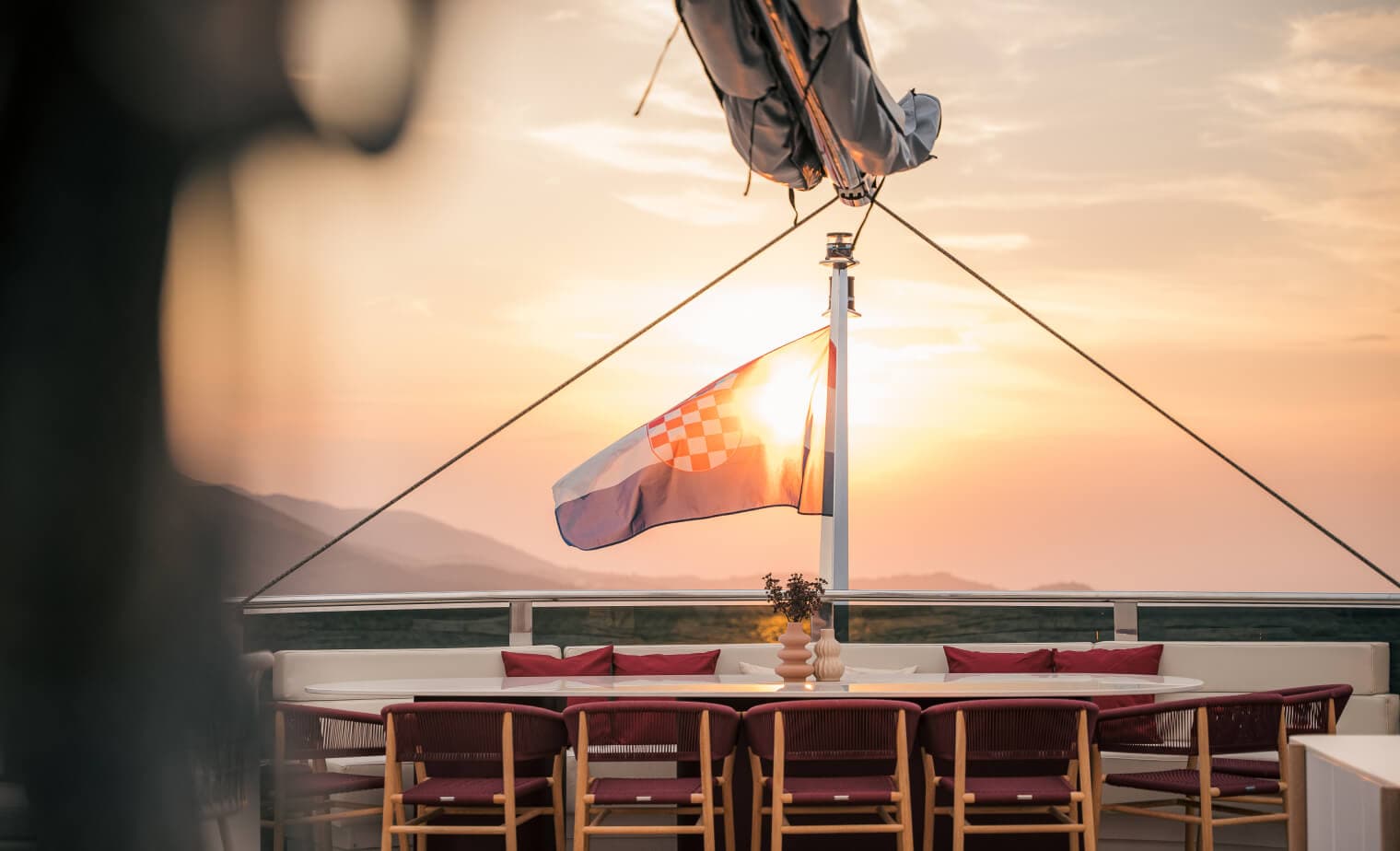 Reposado aft deck dining at sunset